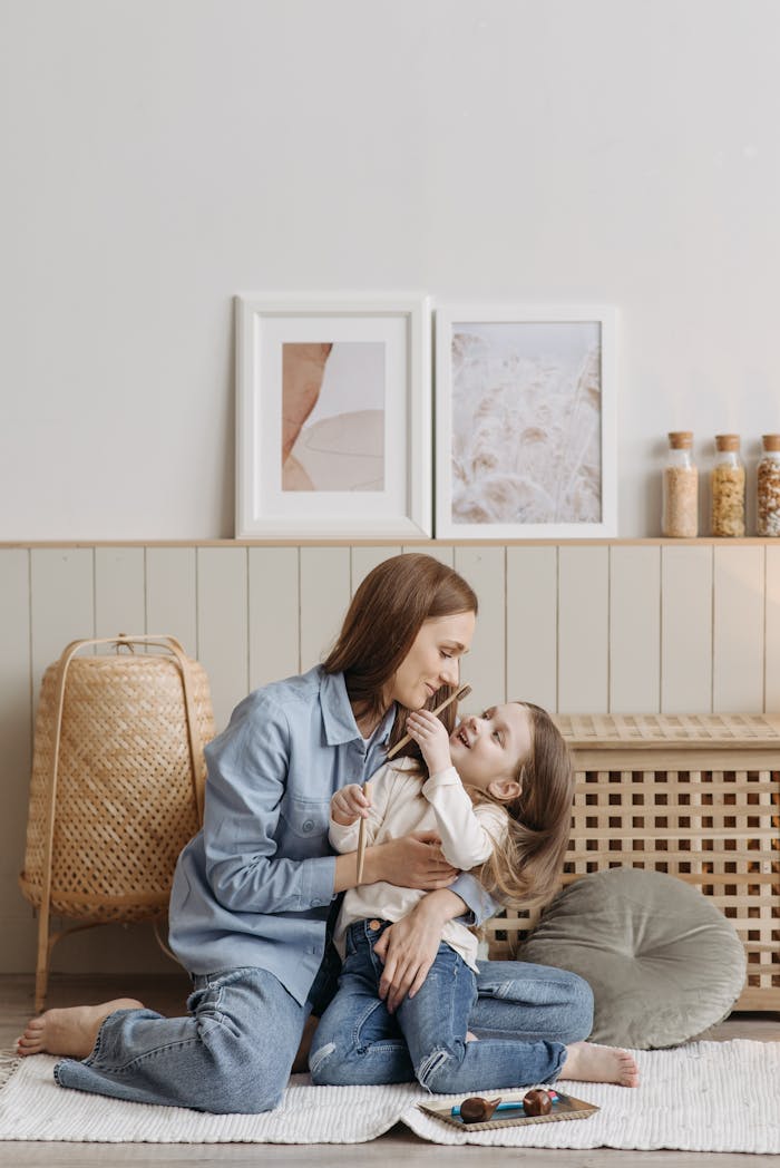 About A mother and daughter embracing in a cozy indoor setting, showcasing family love.